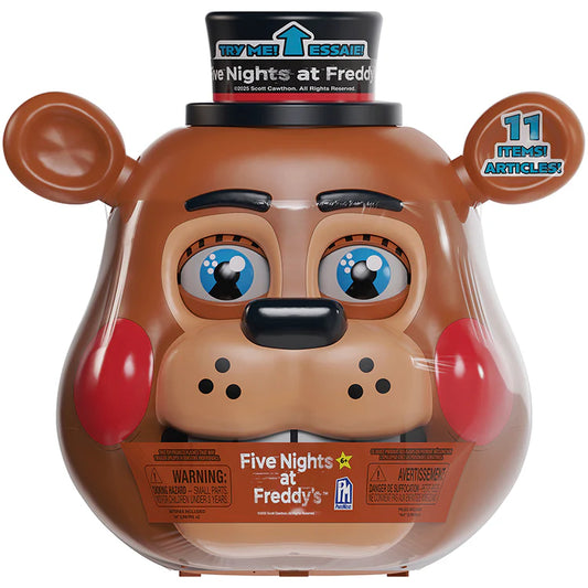 Five Nights at Freddy's Freddy Fazbear toy container featuring a brown bear face with blue eyes, red cheeks, and a black top hat. The clear plastic container shows a Freddy-themed interior and includes printed packaging text on the hat and front label.