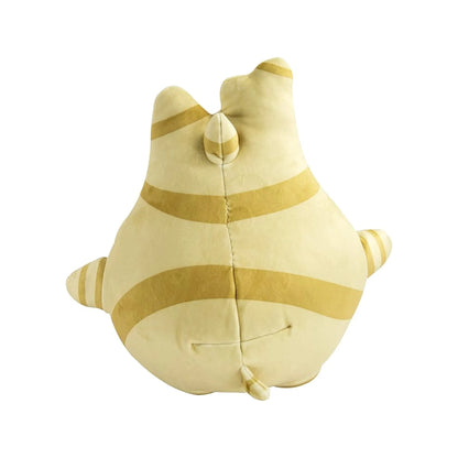 A plush toy shaped like a small cartoon creature, shown from the back. The toy is cream-colored with mustard yellow stripes, set against a plain white background.