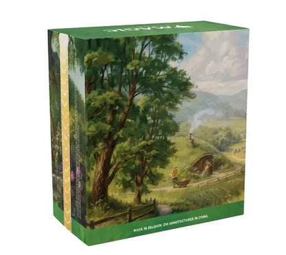 A boxed set with a green top and bottom border and a painted landscape illustration on the front, showing a forested hillside village scene. The product is photographed on a plain white background.