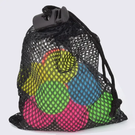 A black mesh drawstring bag with a black plastic clasp, containing several brightly colored round balls in yellow, blue, green, and pink, photographed on a light gray background.