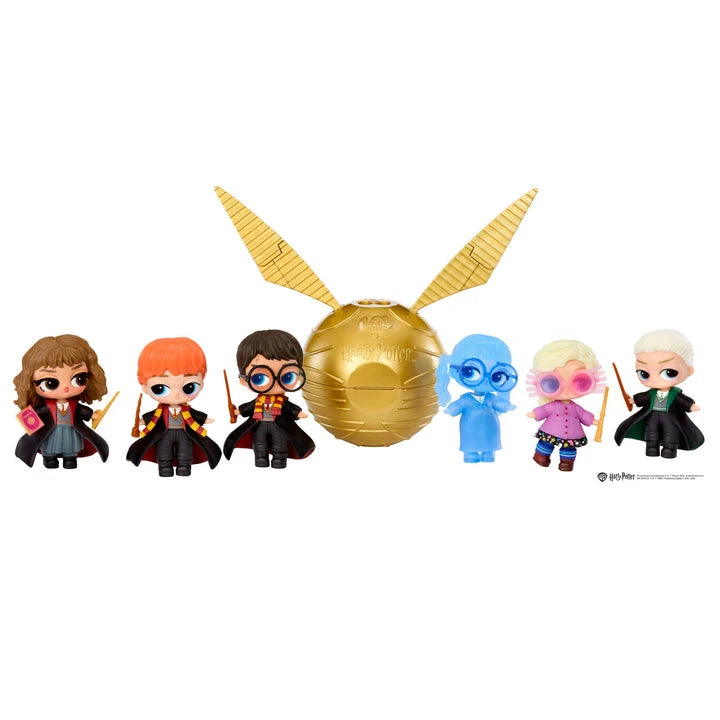 Set of Harry Potter-themed figurines with a golden ball and wands on a white background