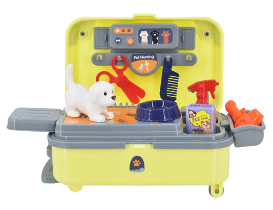 A yellow and gray plastic pet grooming toy set with a small white dog figure, grooming tools, bowls, and accessories, shown on a plain white background.